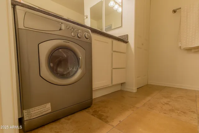 a view of a hallway with washer and dryer