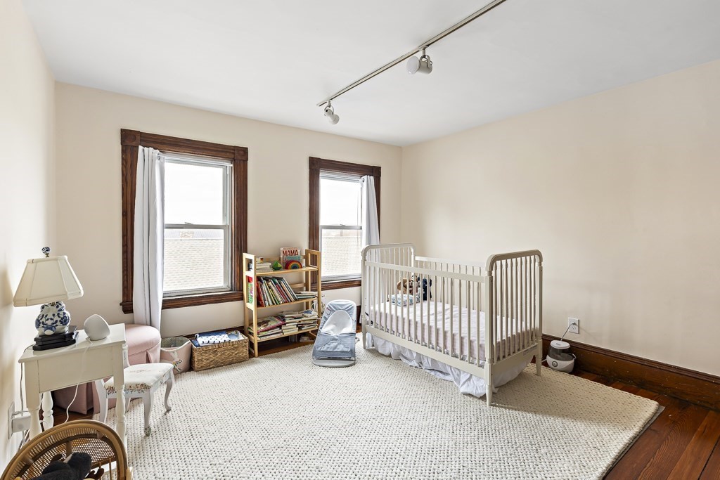 55 Main Street Somerville, MA 02145 - Photo 24 of 28 a bedroom with furniture and a window