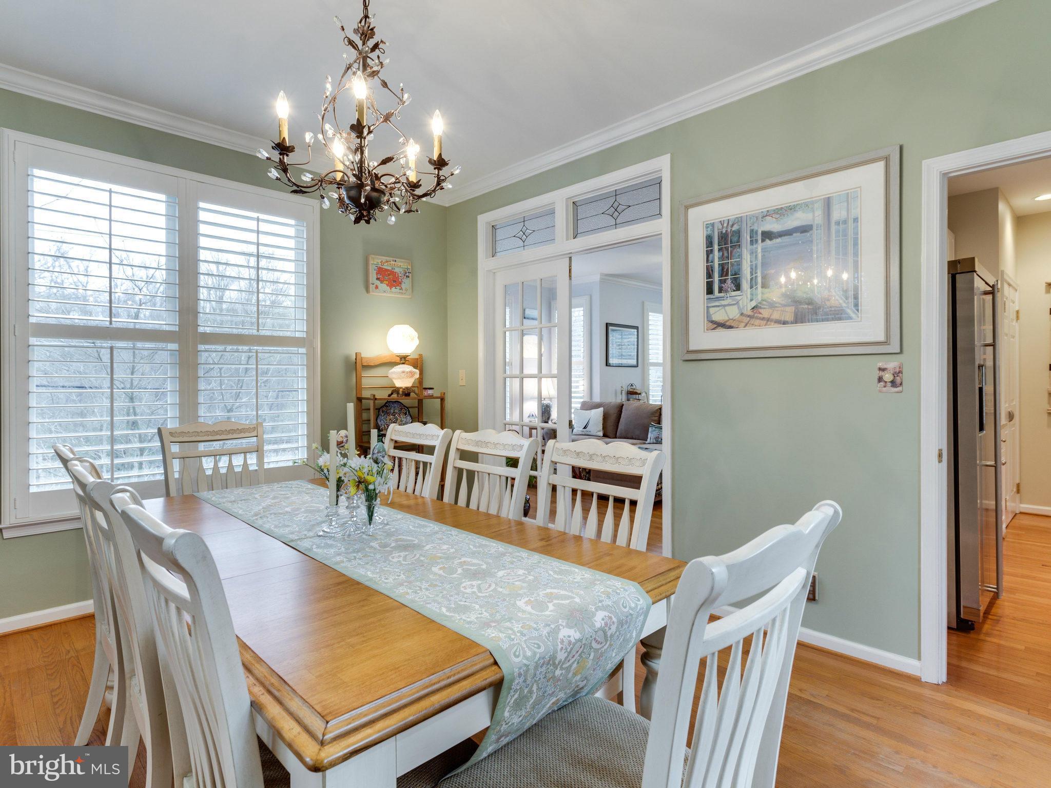 12515 Chapel Road Clifton, VA 20124 - Photo 12 of 30 a living room with furniture a dining table and a chandelier