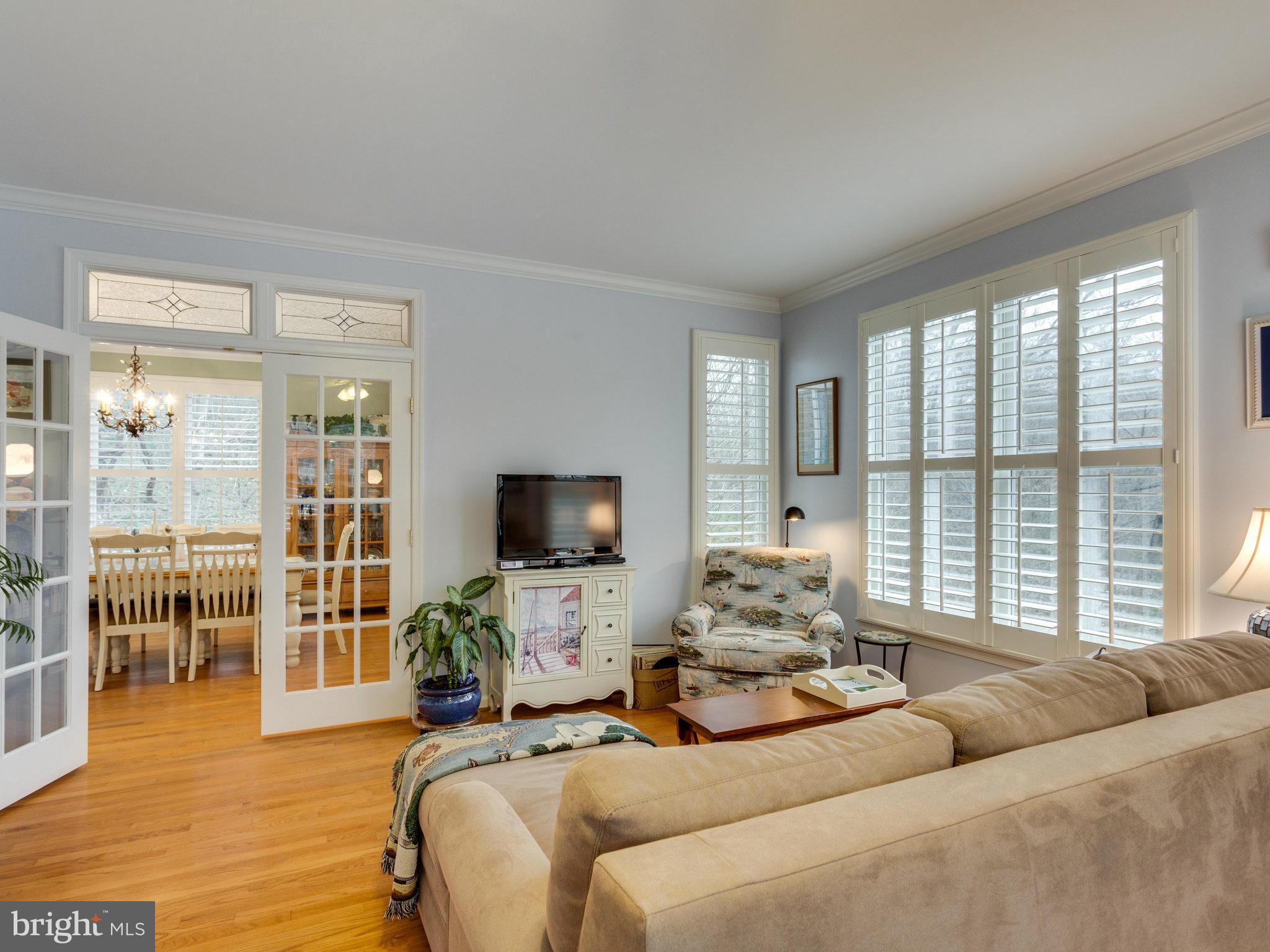 12515 Chapel Road Clifton, VA 20124 - Photo 17 of 30 a living room with furniture a flat screen tv and a large window