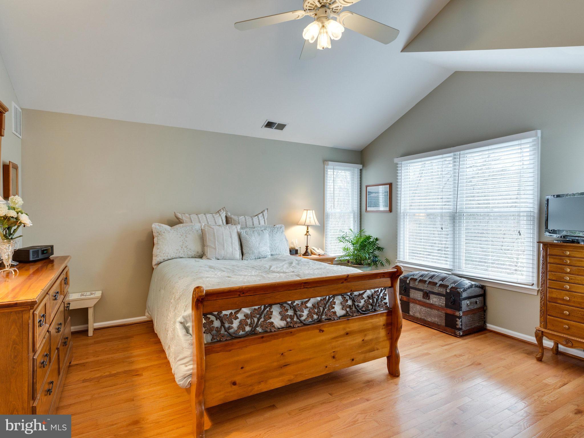 12515 Chapel Road Clifton, VA 20124 - Photo 19 of 30 a bedroom with a bed and a chandelier