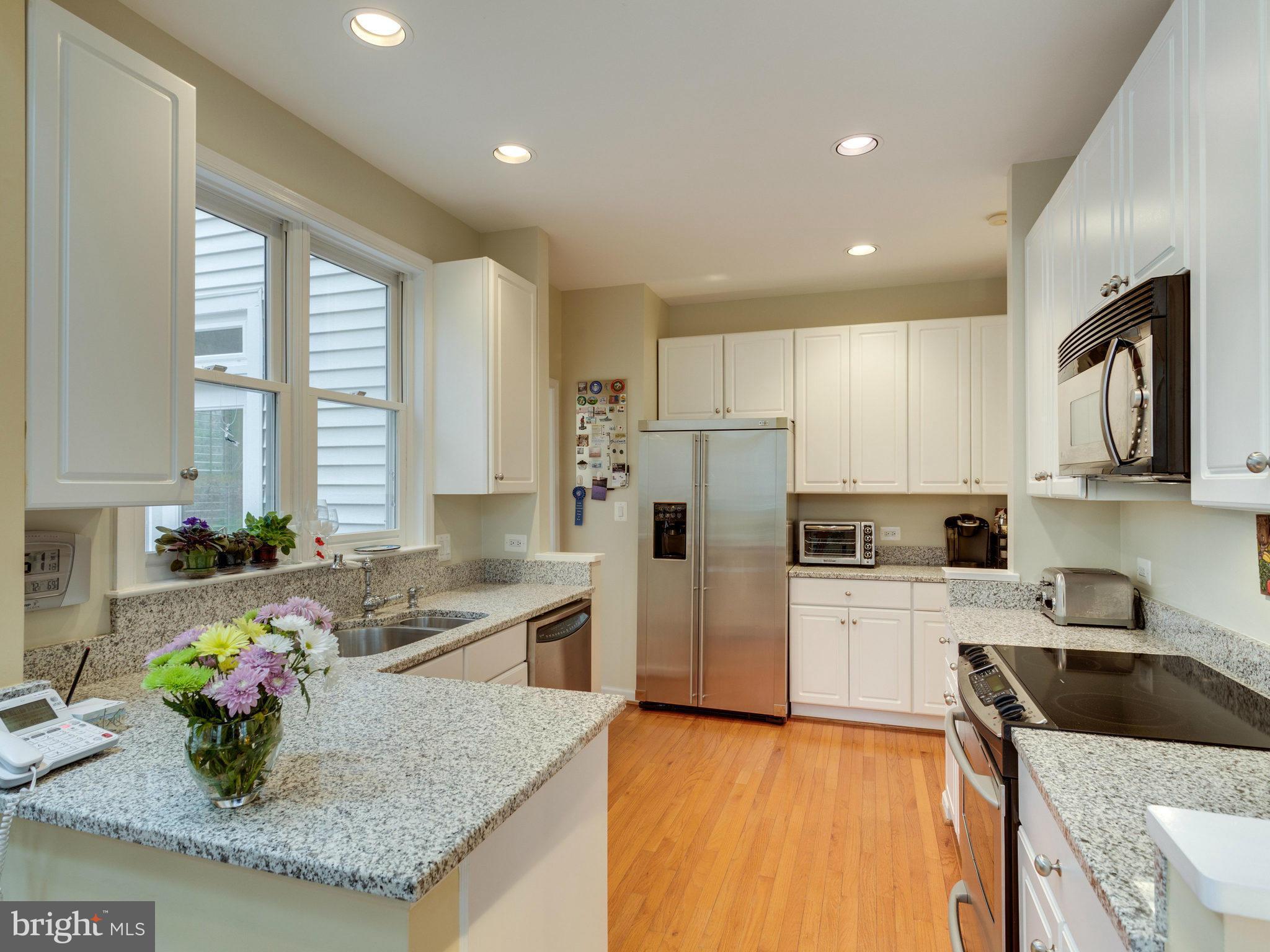 12515 Chapel Road Clifton, VA 20124 - Photo 10 of 30 a kitchen that has a sink cabinets and refrigerator