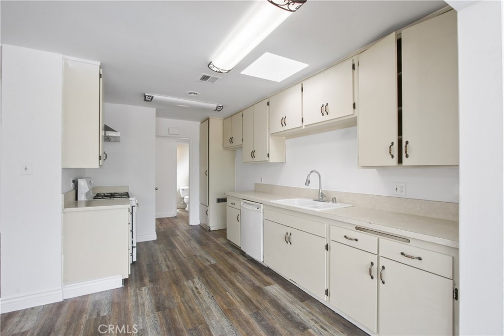 1924 Via Del Rio Corona, CA 92882 - Photo 6 of 15 a kitchen with sink cabinets and wooden floor