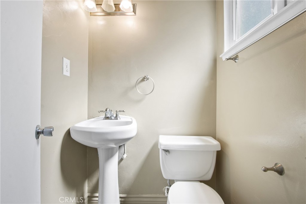 1924 Via Del Rio Corona, CA 92882 - Photo 7 of 15 a bathroom with a toilet sink and mirror
