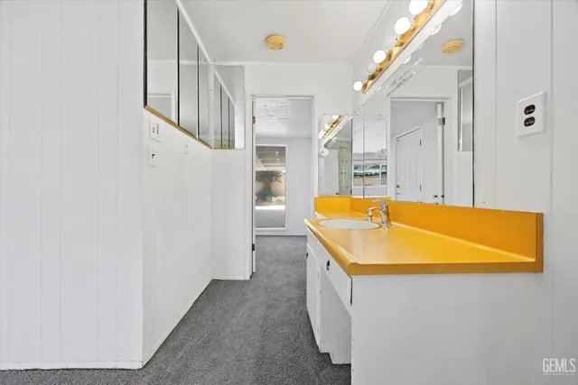 a view of room with balcony and a ceiling fan