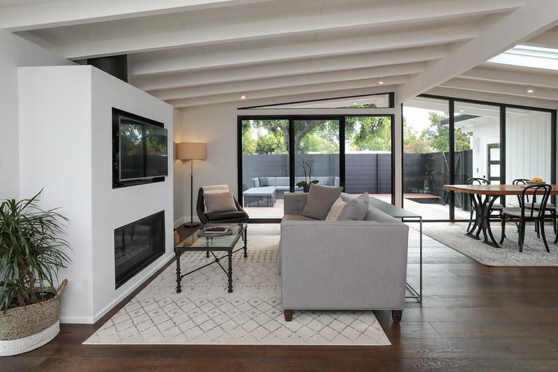 246 Hamilton Avenue Mountain View, CA 94043 - Photo 3 of 25 a living room with furniture and a fireplace