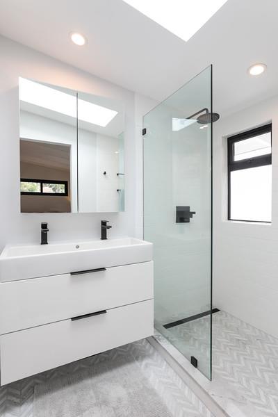 246 Hamilton Avenue Mountain View, CA 94043 - Photo 10 of 25 a bathroom with a sink a mirror and a shower