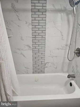 a bathroom with a bathtub