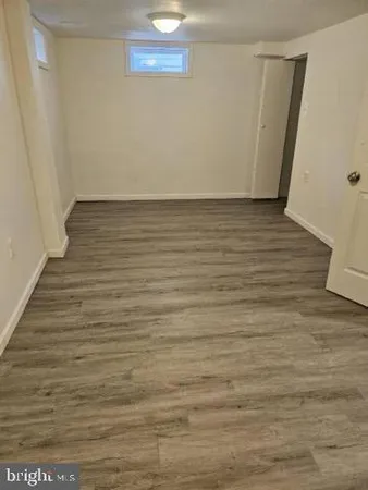 a view of room with wooden floor