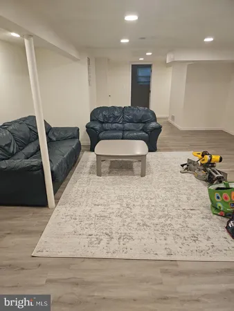 a living room with furniture and a rug
