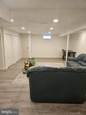 a living room with hard wood flooring