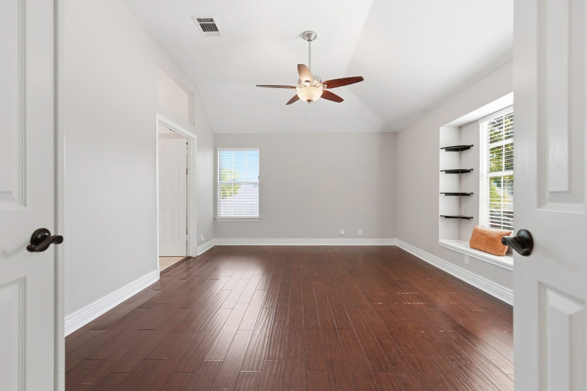 1108 Red Bird Drive Cedar Park, TX 78613 - Photo 16 of 30 wooden floor in an empty room with a window