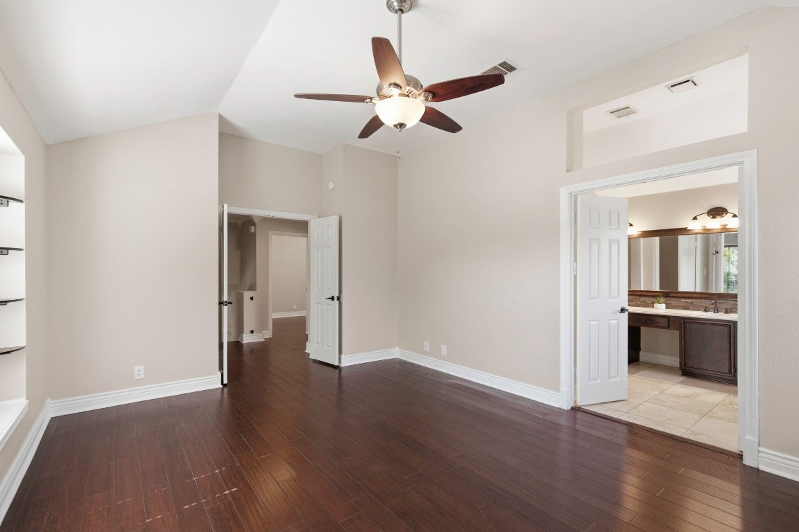 1108 Red Bird Drive Cedar Park, TX 78613 - Photo 18 of 30 a view of an empty room with wooden floor and a window
