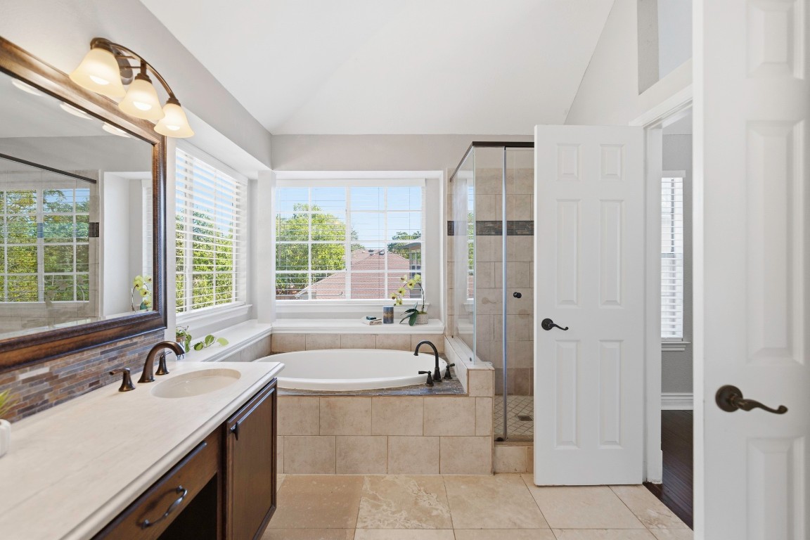 1108 Red Bird Drive Cedar Park, TX 78613 - Photo 19 of 30 a bathroom with a tub sink and mirror