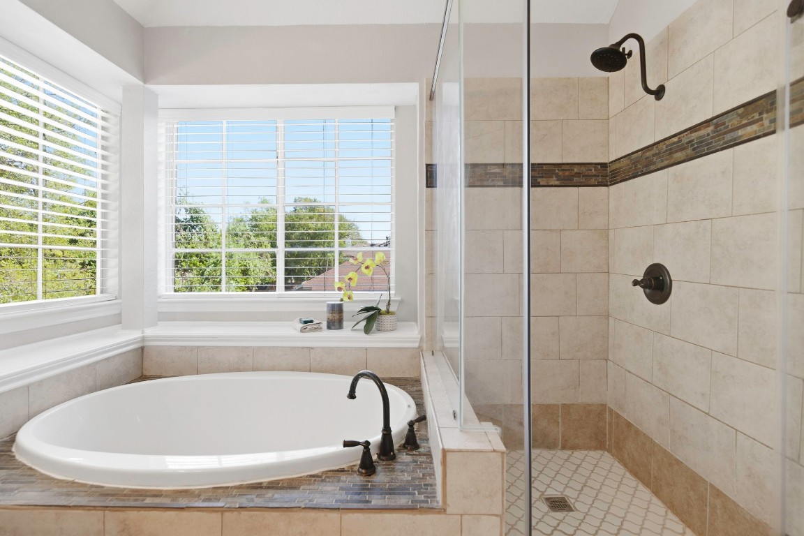 1108 Red Bird Drive Cedar Park, TX 78613 - Photo 20 of 30 a bathroom with a bath tub and a shower
