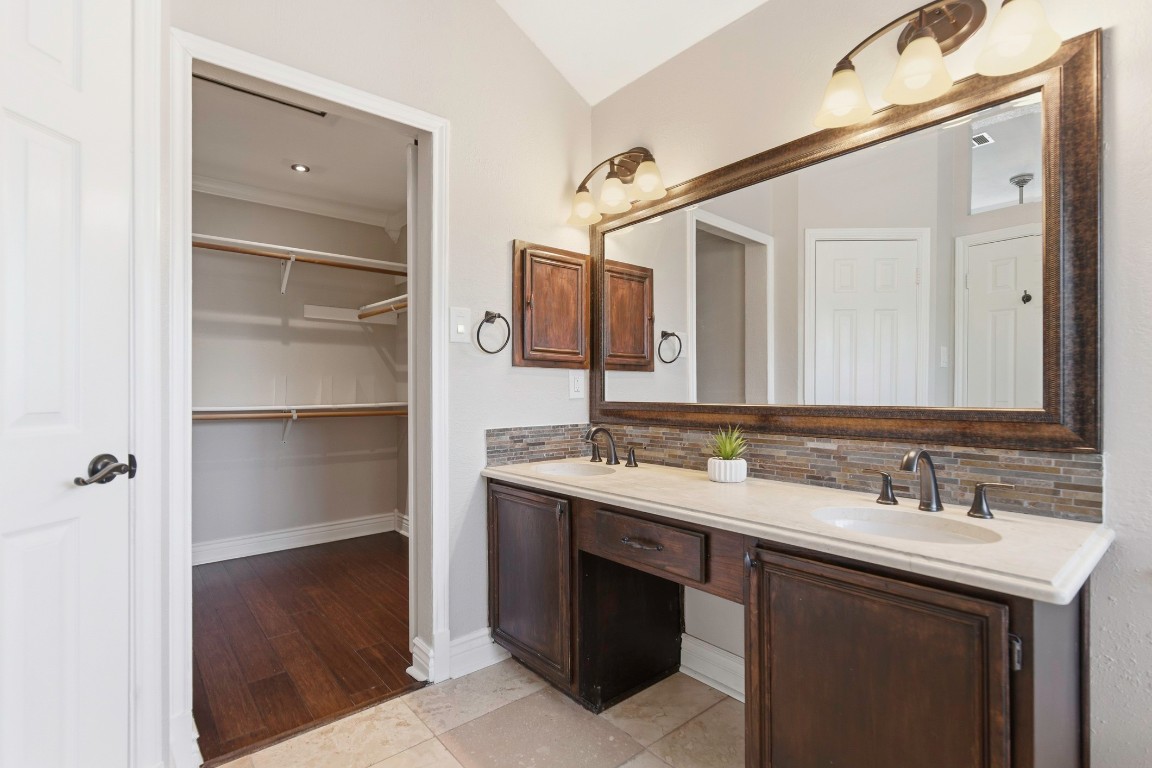 1108 Red Bird Drive Cedar Park, TX 78613 - Photo 21 of 30 a bathroom with a sink and a mirror