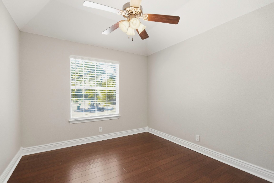 1108 Red Bird Drive Cedar Park, TX 78613 - Photo 24 of 30 an empty room with wooden floor and windows