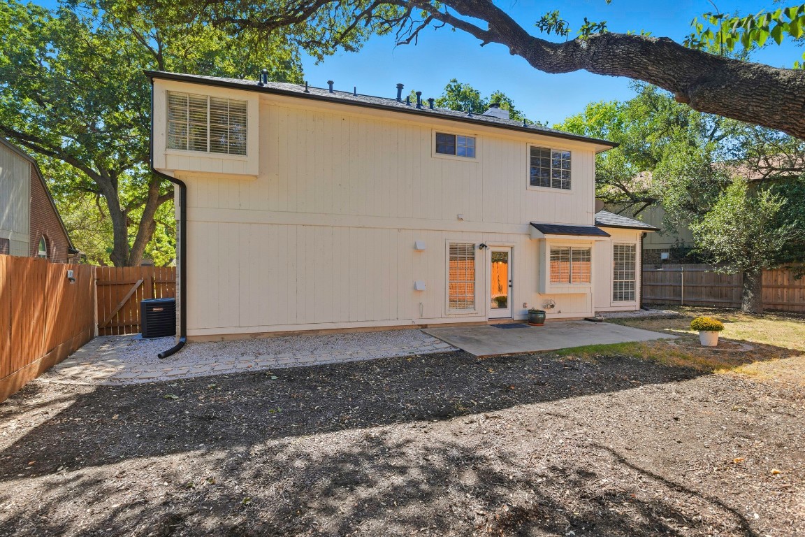 1108 Red Bird Drive Cedar Park, TX 78613 - Photo 29 of 30 a view of a white house next to a yard and road