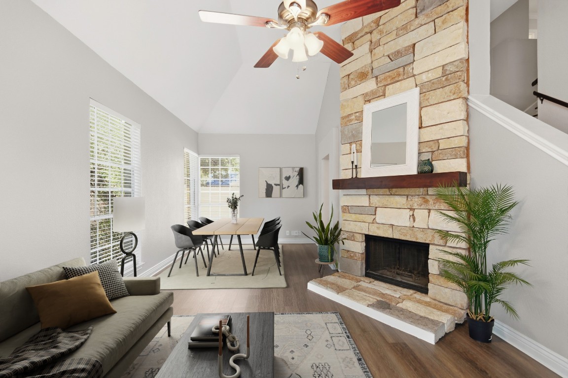 1108 Red Bird Drive Cedar Park, TX 78613 - Photo 3 of 30 a living room with furniture a fireplace and a potted plant