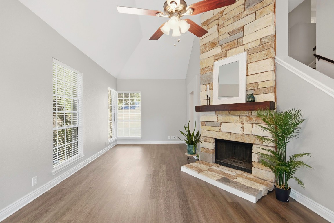 1108 Red Bird Drive Cedar Park, TX 78613 - Photo 4 of 30 a living room with a fireplace with wooden floor