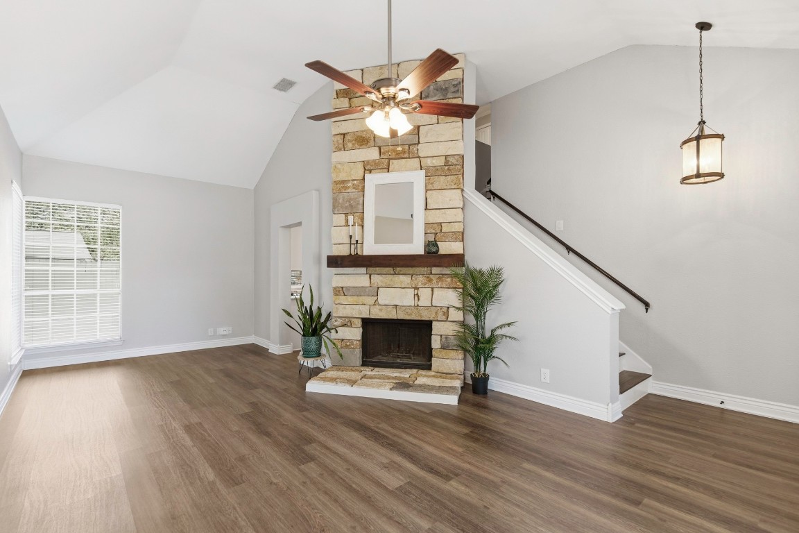 1108 Red Bird Drive Cedar Park, TX 78613 - Photo 5 of 30 a view of an empty room with wooden floor fireplace and a window
