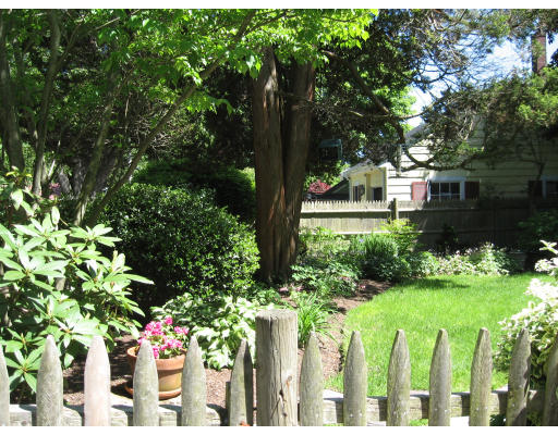 18 Preston Beach Road Marblehead, MA 01945 - Photo 8 of 11 a garden with plants in front of main door