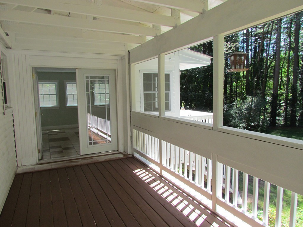 46 Old Mill Road Sutton, MA 01590 - Photo 16 of 23 a view of a house with porch and wooden floor