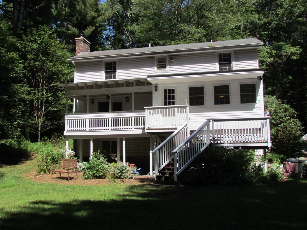 46 Old Mill Road Sutton, MA 01590 - Photo 3 of 23 a front view of a house with a yard