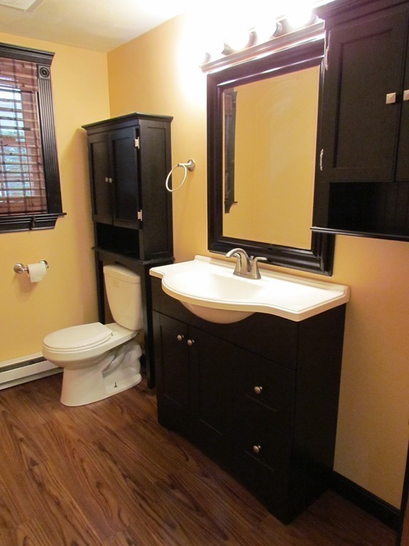 46 Old Mill Road Sutton, MA 01590 - Photo 6 of 23 a bathroom with a sink toilet and mirror