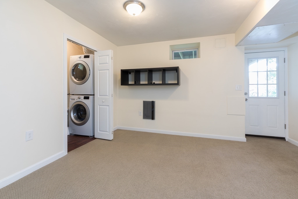 59 Florence Road Waltham, MA 02453 - Photo 17 of 20 a view of a livingroom with a washer and dryer