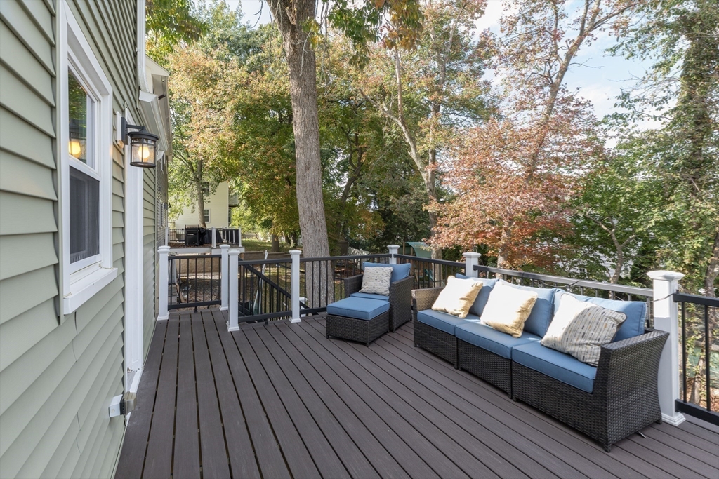 59 Florence Road Waltham, MA 02453 - Photo 18 of 20 a view of roof deck with couches and wooden floor