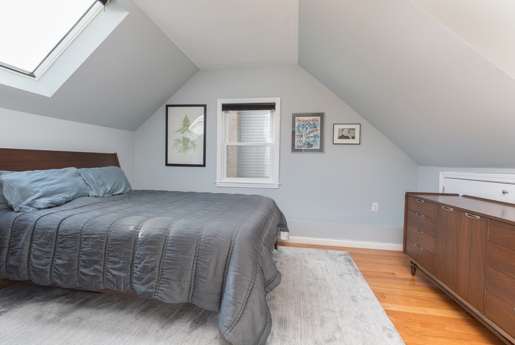 59 Florence Road Waltham, MA 02453 - Photo 10 of 20 a bedroom with a bed and a cabinets