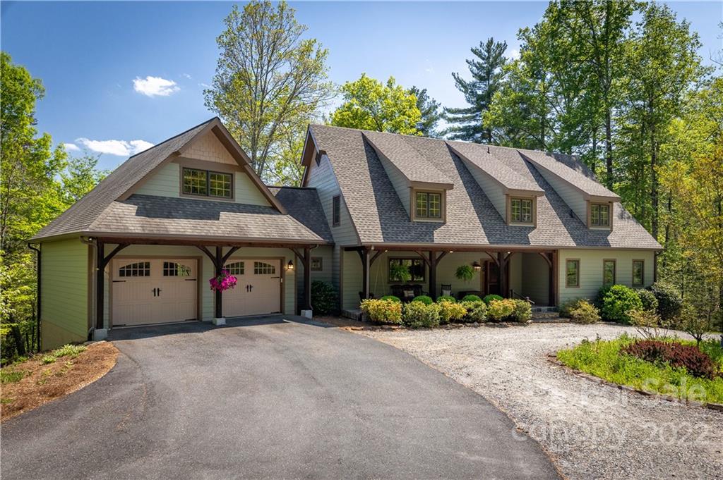 1553 Zacks Fork Road Lenoir, NC 28645 - Photo 1 of 48 a front view of a house with a yard and garage