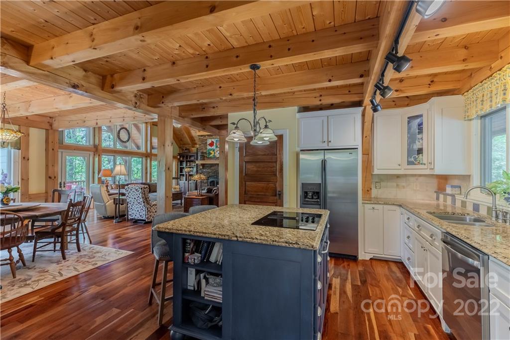 1553 Zacks Fork Road Lenoir, NC 28645 - Photo 11 of 48 a kitchen with stainless steel appliances granite countertop a sink stove and cabinets