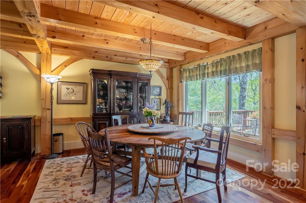 1553 Zacks Fork Road Lenoir, NC 28645 - Photo 14 of 48 a view of a dining room with furniture window and wooden floor