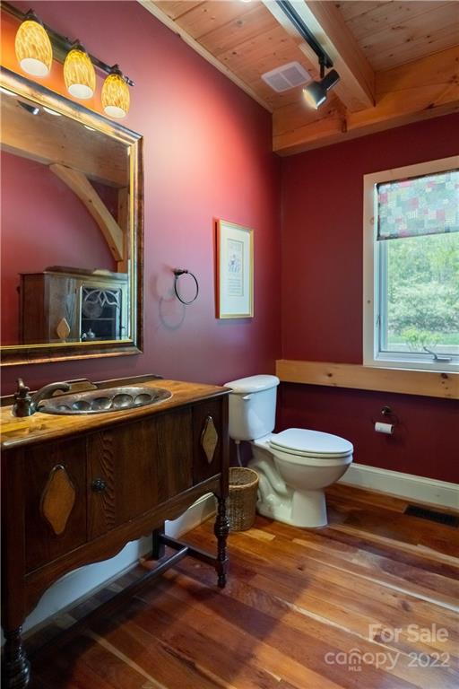 1553 Zacks Fork Road Lenoir, NC 28645 - Photo 15 of 48 a bathroom with a sink a toilet and mirror