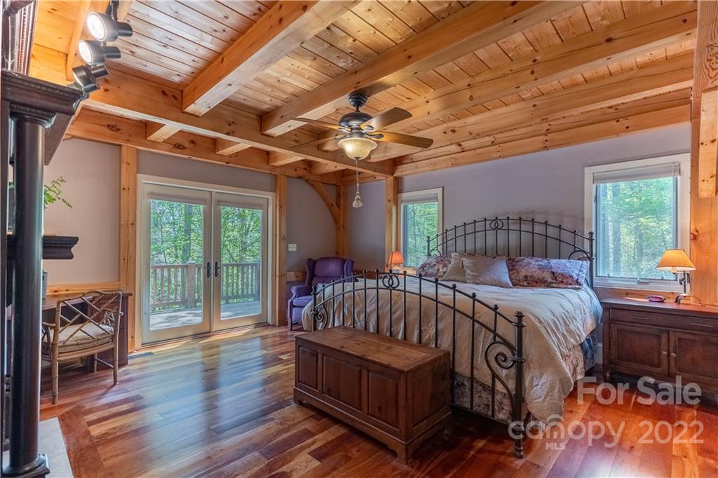 1553 Zacks Fork Road Lenoir, NC 28645 - Photo 17 of 48 a bed sitting in a bedroom next to a window