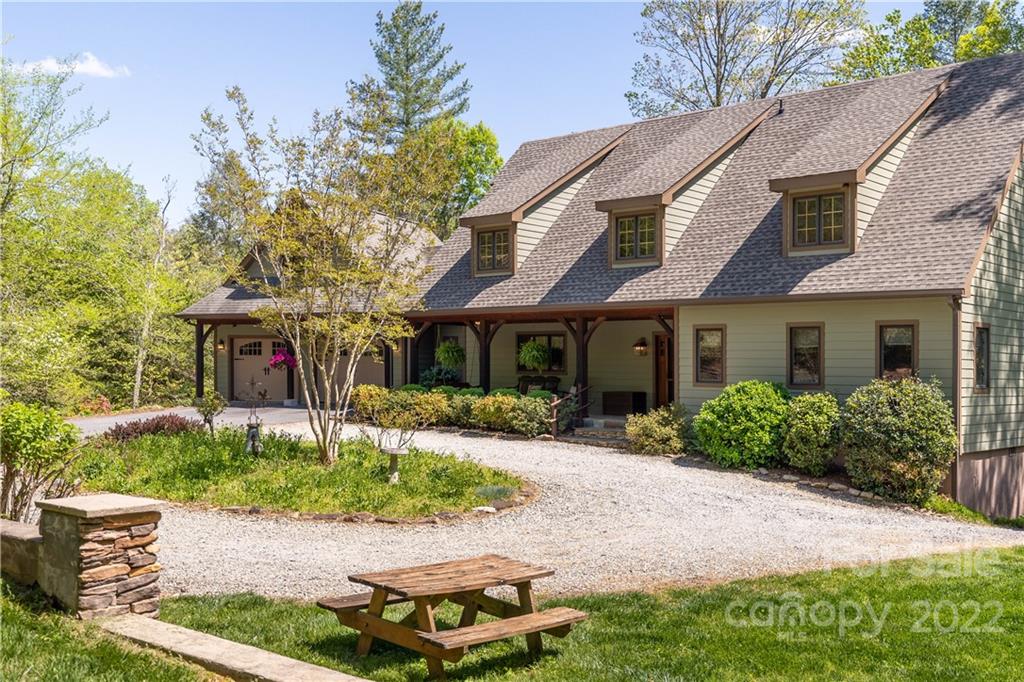 1553 Zacks Fork Road Lenoir, NC 28645 - Photo 2 of 48 a front view of a house with a yard and potted plants