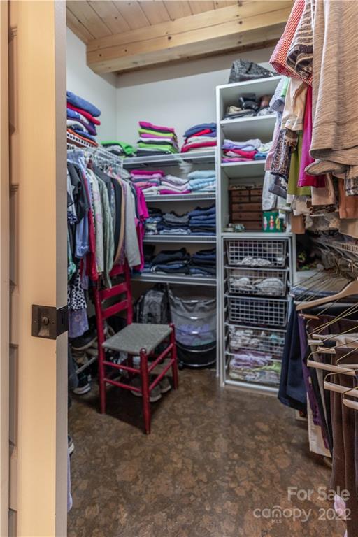 1553 Zacks Fork Road Lenoir, NC 28645 - Photo 21 of 48 a view of walk in closet with clothes and shoes