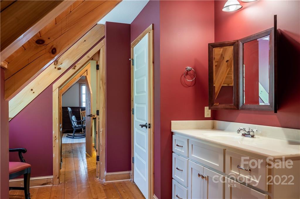 1553 Zacks Fork Road Lenoir, NC 28645 - Photo 25 of 48 a bathroom with a sink and a mirror