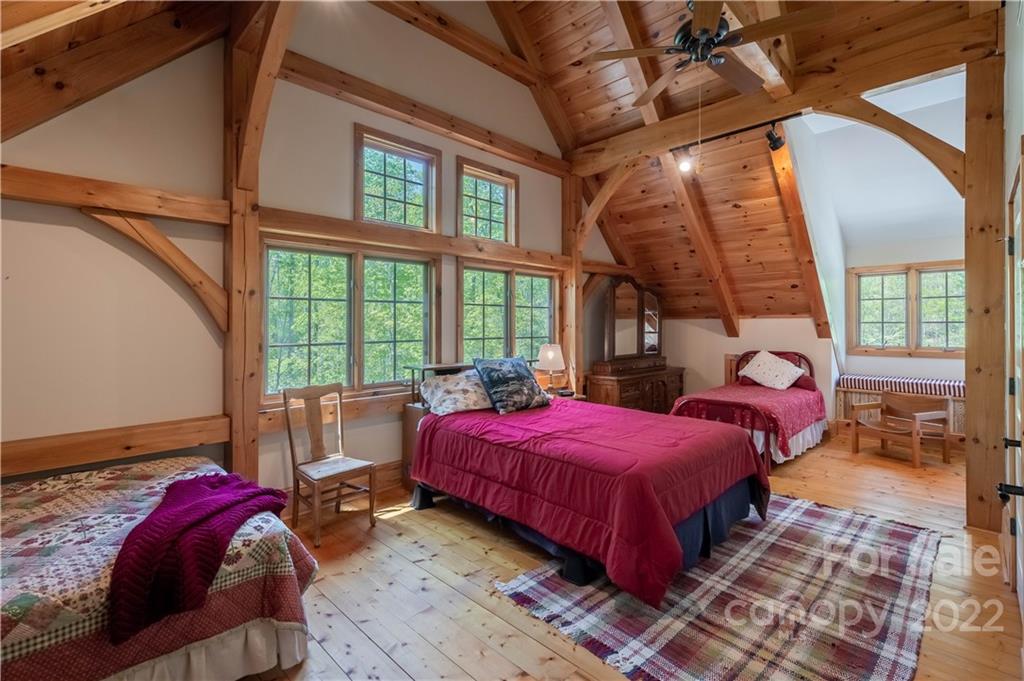 1553 Zacks Fork Road Lenoir, NC 28645 - Photo 26 of 48 a bedroom with a bed and a large window