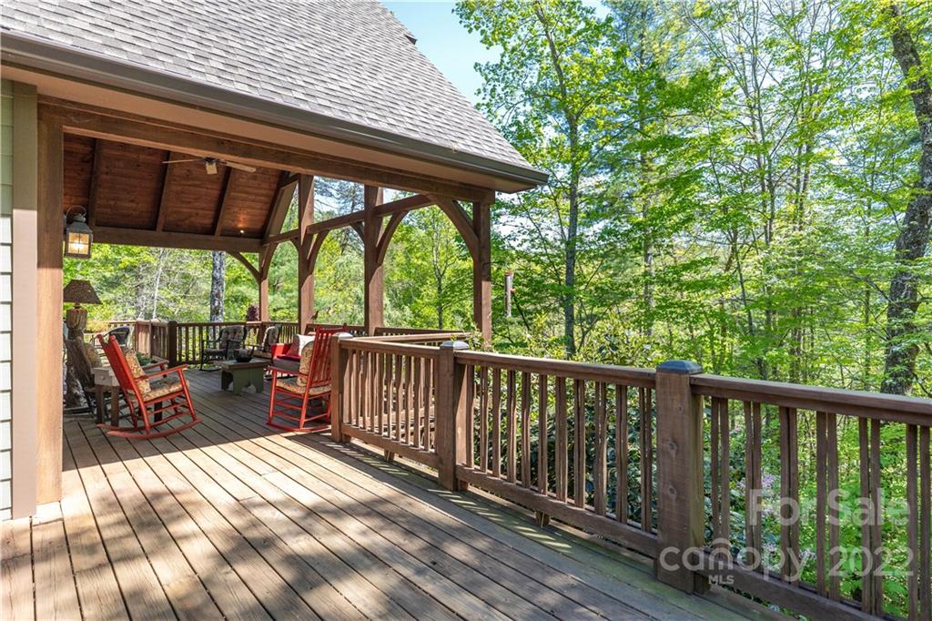 1553 Zacks Fork Road Lenoir, NC 28645 - Photo 33 of 48 a view of porch with wooden floor outdoor seating and yard