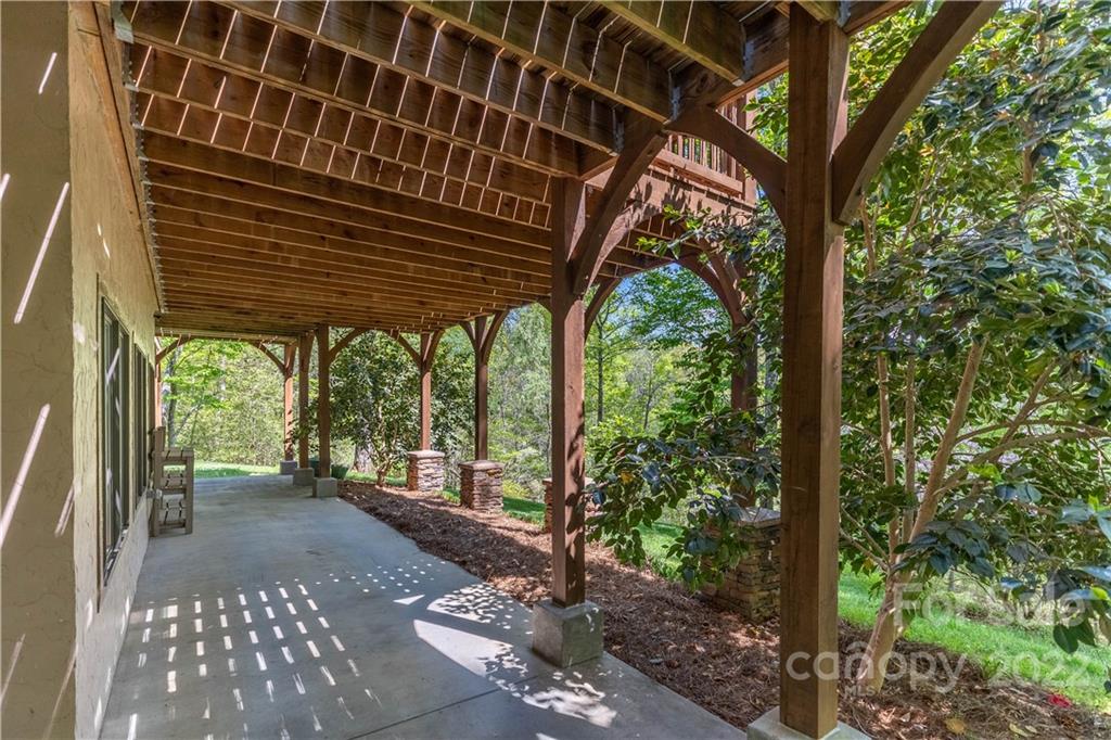 1553 Zacks Fork Road Lenoir, NC 28645 - Photo 34 of 48 a view of a porch with wooden floor and outdoor space