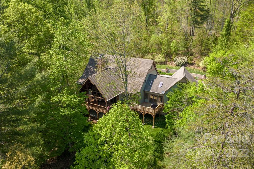 1553 Zacks Fork Road Lenoir, NC 28645 - Photo 42 of 48 an aerial view of a house with outdoor space and trees all around
