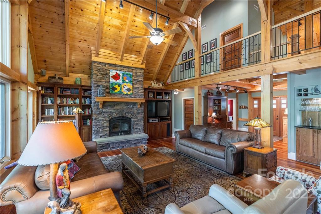 1553 Zacks Fork Road Lenoir, NC 28645 - Photo 6 of 48 a outdoor living space with patio furniture and a fireplace