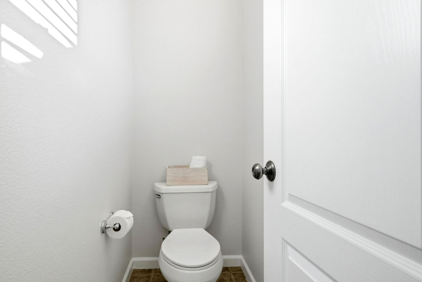 2556 Harlow Lane San Ramon, CA 94582 - Photo 34 of 62 a white toilet sitting next to a shower