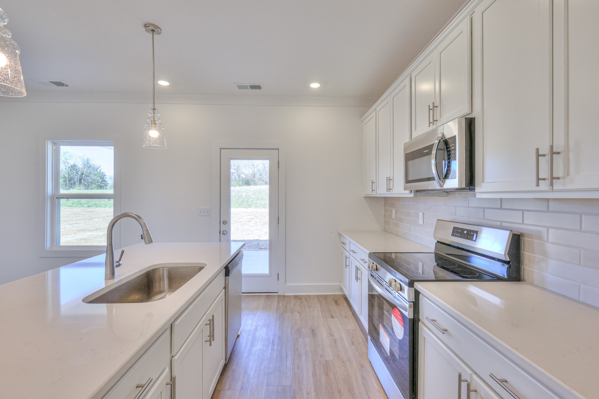 2259 Duchess Boulevard Gallatin, TN 37066 - Photo 13 of 44 a kitchen that has a sink and a stove