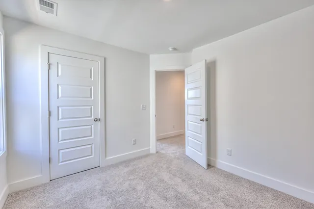 a view of storage and utility room with racks on the wall