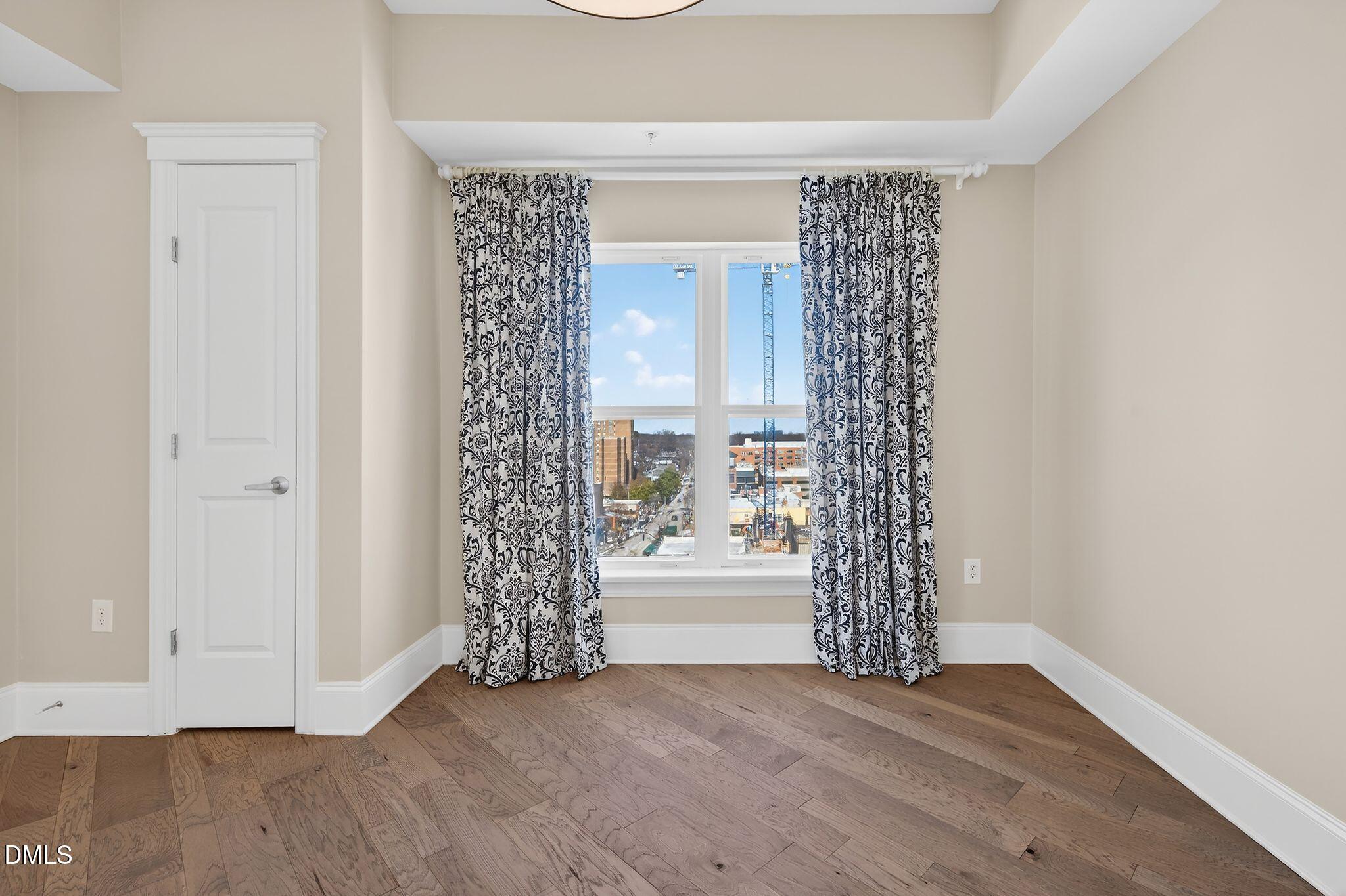 222 Glenwood Avenue, Unit 605 Raleigh, NC 27603 - Photo 21 of 60 a view of entryway with wooden floor
