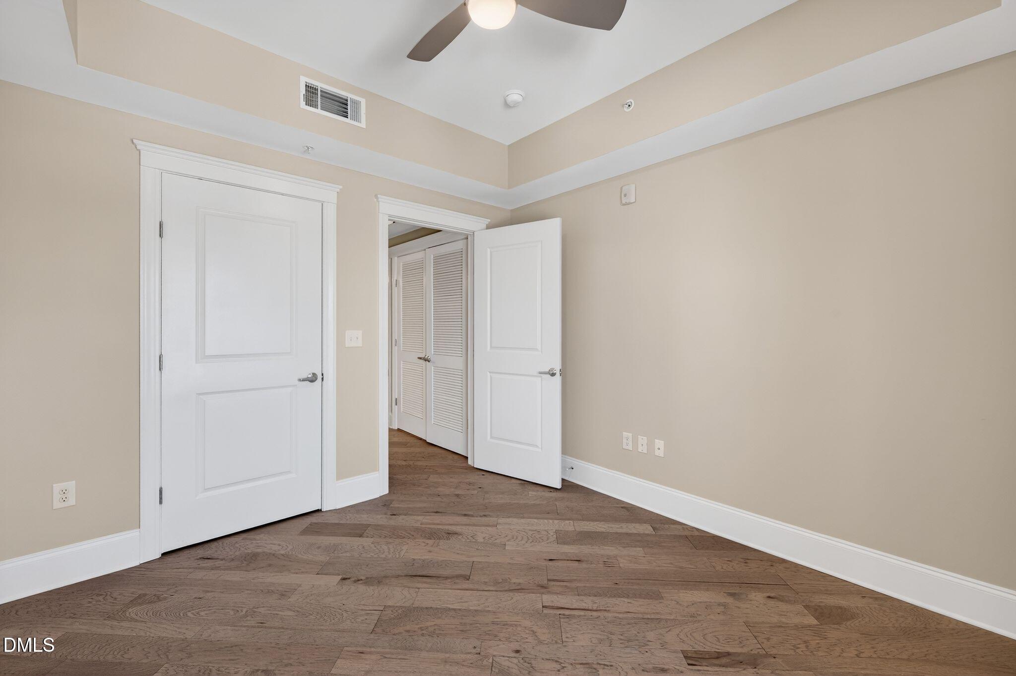 222 Glenwood Avenue, Unit 605 Raleigh, NC 27603 - Photo 32 of 60 wooden floor in an empty room